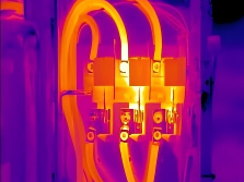 Thermal image of an electrical panel showing hot fuse terminals
